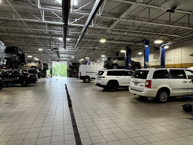 Technician servicing a Ram 3500 diesel truck